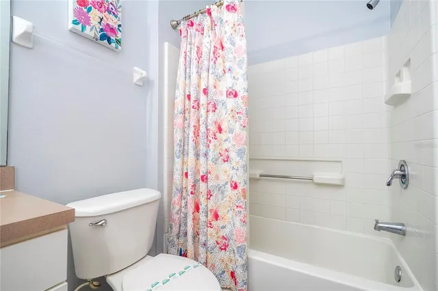 a view of an outdoor space with furniture and umbrella