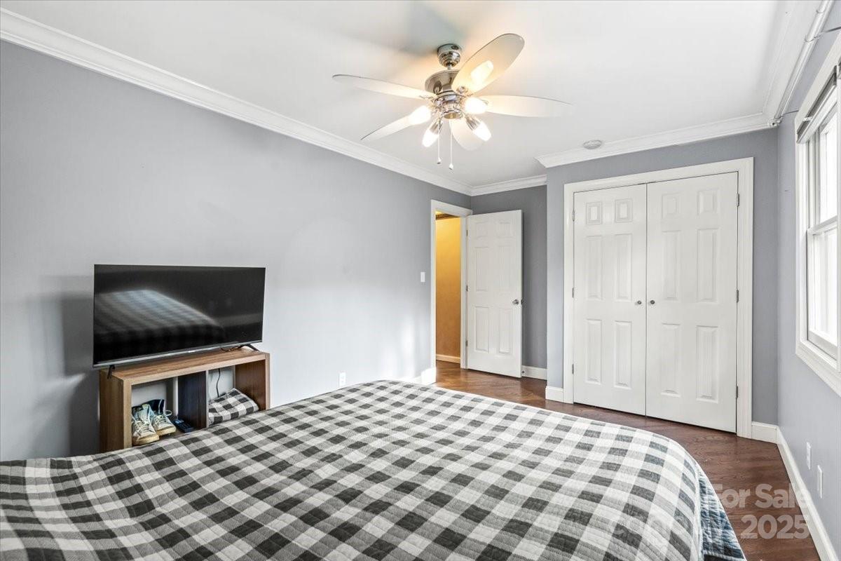 7918 Sarah Drive Denver, NC 28037 - Photo 14 of 31 a bedroom with a bed and a flat screen tv