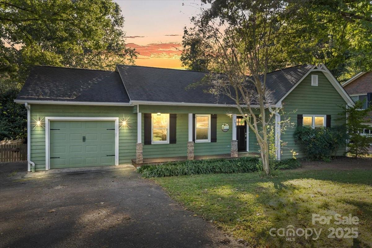 7918 Sarah Drive Denver, NC 28037 - Photo 2 of 31 a front view of a house with garden