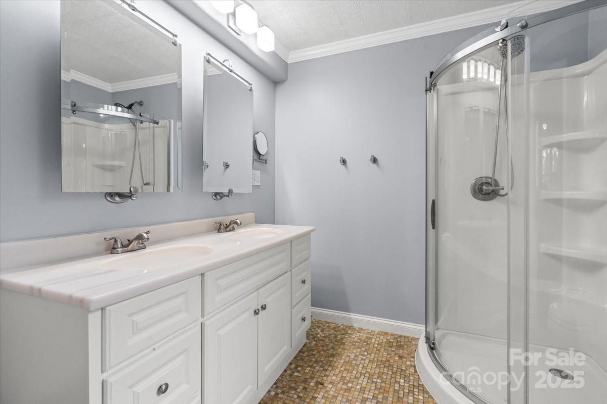 7918 Sarah Drive Denver, NC 28037 - Photo 24 of 31 a bathroom with a sink and a mirror