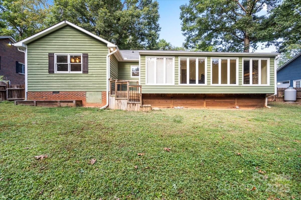 7918 Sarah Drive Denver, NC 28037 - Photo 27 of 31 a backyard of a house with wooden deck and backyard