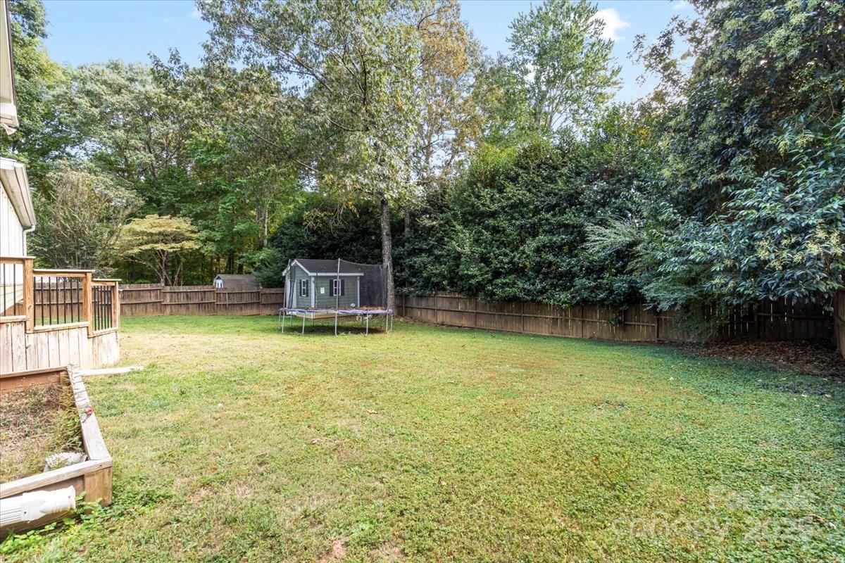 7918 Sarah Drive Denver, NC 28037 - Photo 29 of 31 a backyard of a house with lots of green space