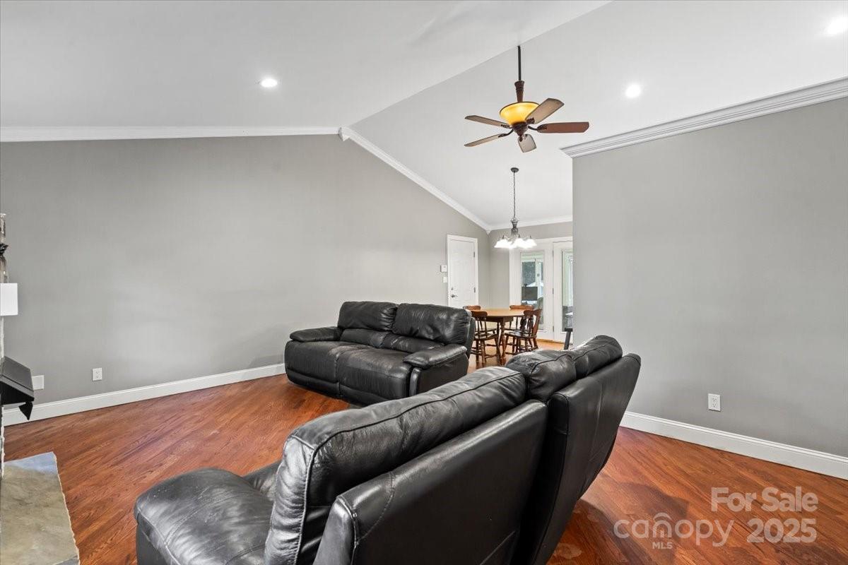 7918 Sarah Drive Denver, NC 28037 - Photo 5 of 31 a living room with furniture and a chandelier