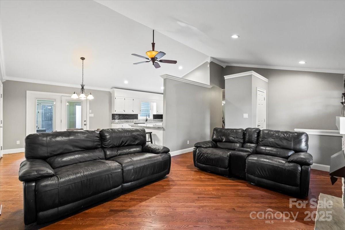 7918 Sarah Drive Denver, NC 28037 - Photo 6 of 31 a living room with furniture kitchen view and a chandelier