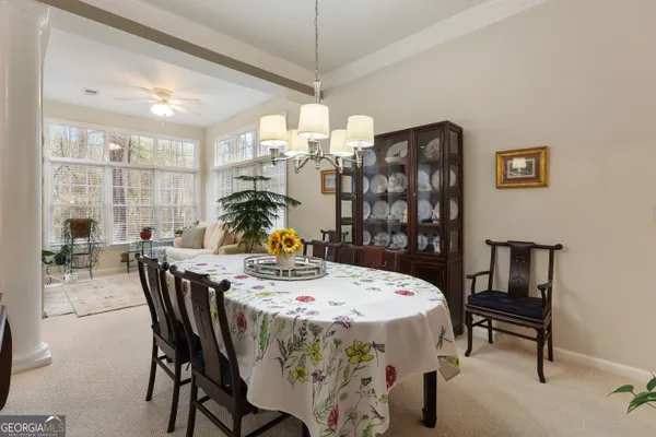 a dining room with furniture and window