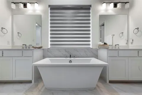 a bathroom with a bathtub and a sink