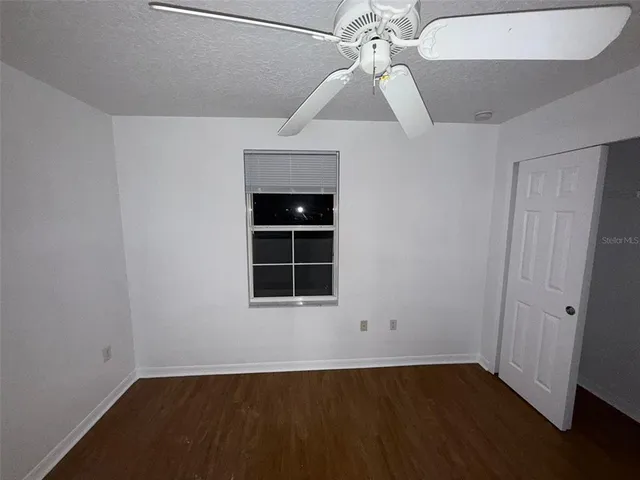 a bathroom with a toilet a sink and vanity