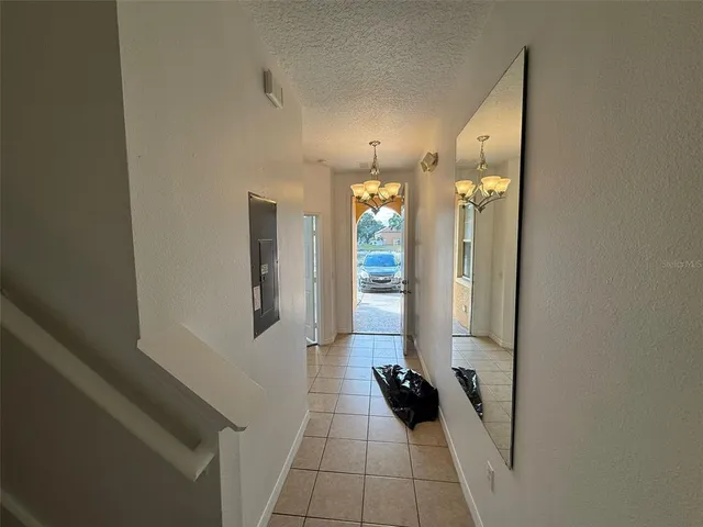 a large kitchen with a large counter top stainless steel appliances and cabinets