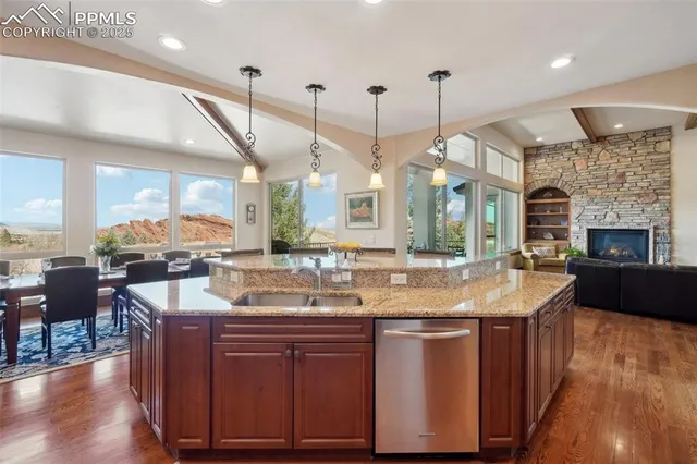 a view of a a dining room with furniture window and wooden floor