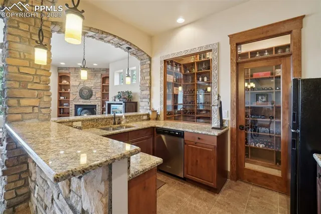 a bedroom with furniture and a fireplace