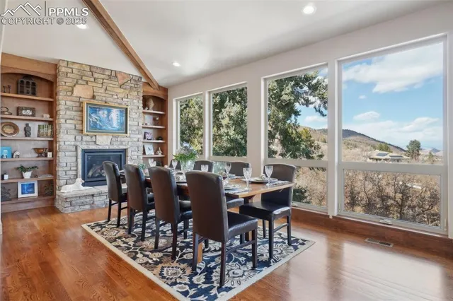 a view of a dining room with furniture window and wooden floor