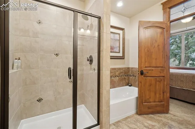 a bedroom with a bed dresser and a window