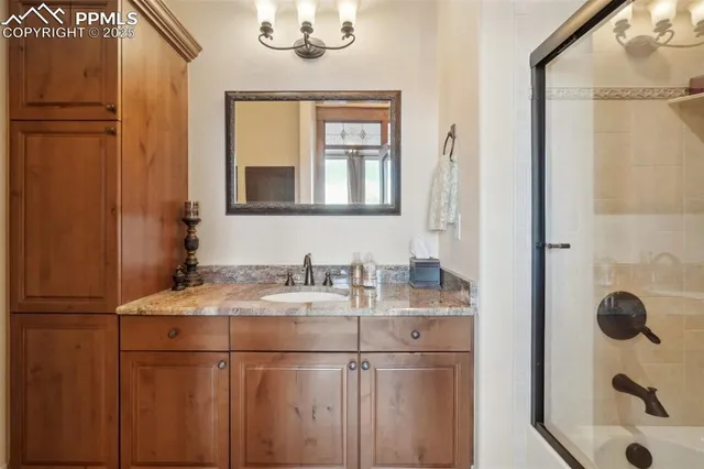 a view of a room with a table and chairs