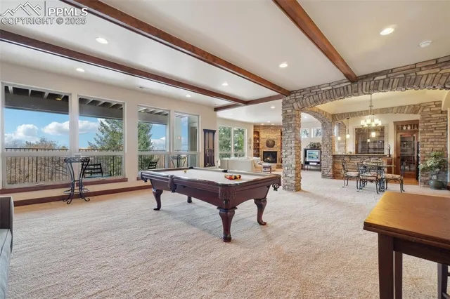 a living room with furniture a table and chairs