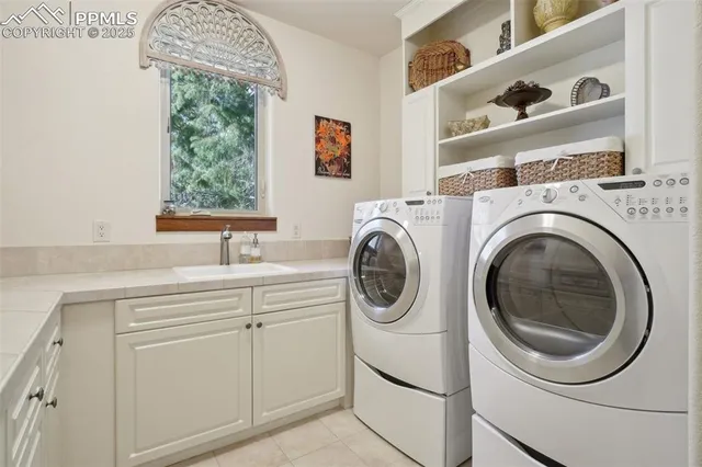 a balcony with furniture and a potted plant
