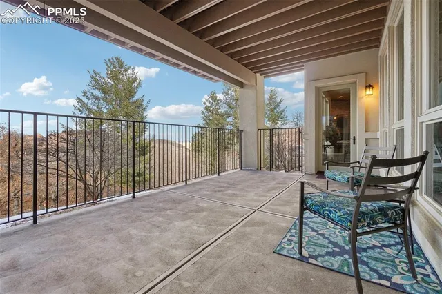 an aerial view of a house with yard and outdoor seating