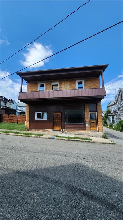 716 Hawthorne Street Vandergrift, PA 15690 - Photo 3 of 11 a view of a building with a street