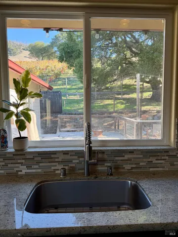 a kitchen sink sitting next to a window