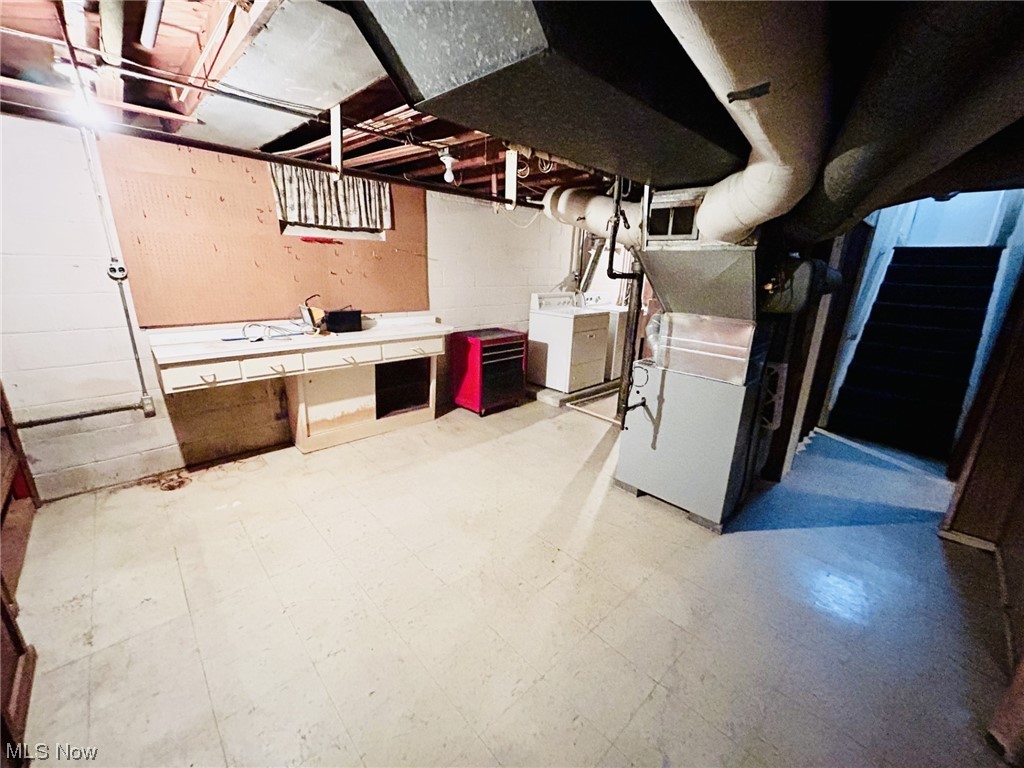 13414 Rockside Road Garfield Heights, OH 44125 - Photo 23 of 25 Basement featuring independent washer and dryer and light tile floors
