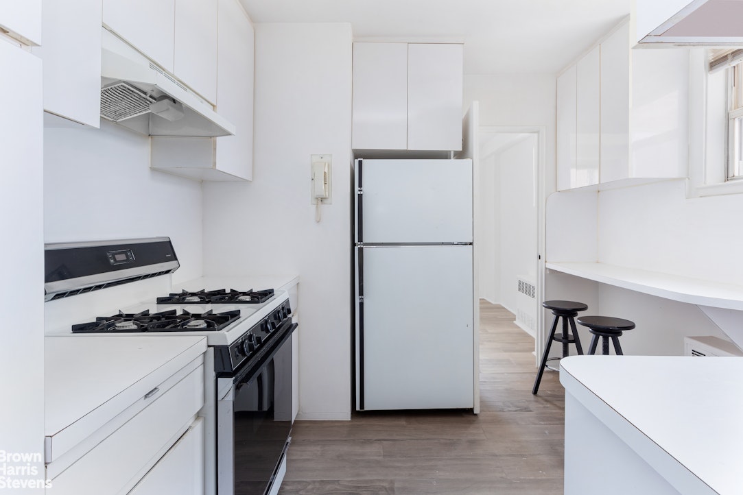 5700 Arlington Avenue, Unit 11X Bronx, NY 10471 - Photo 11 of 21 a kitchen with stainless steel appliances a refrigerator a sink and a stove