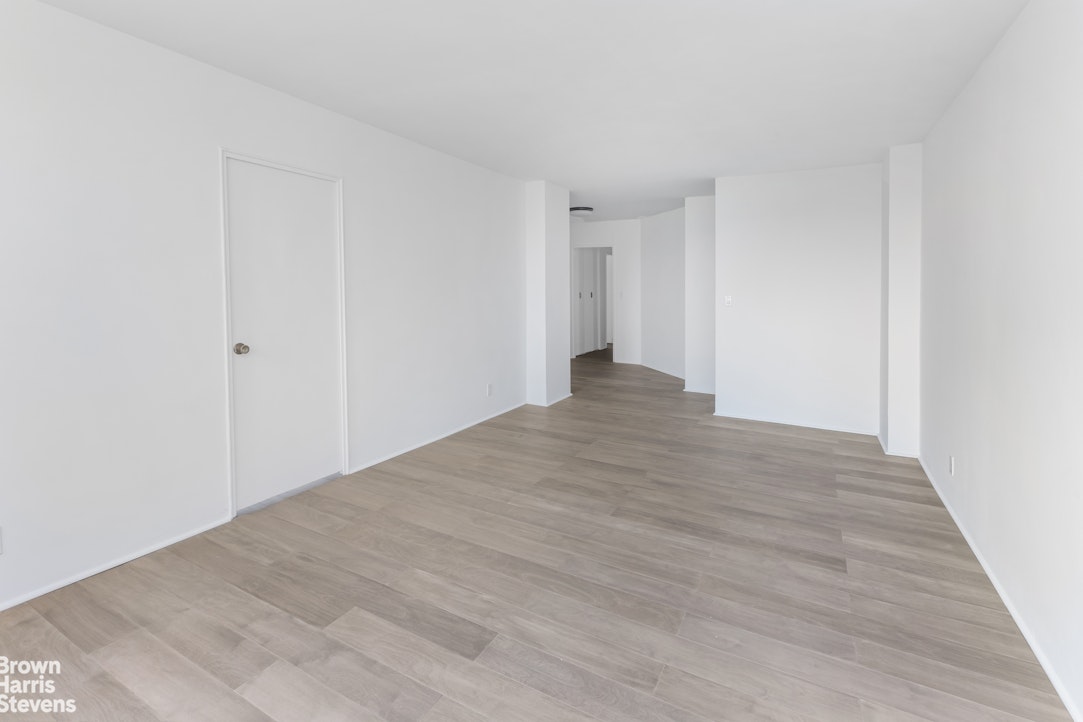 5700 Arlington Avenue, Unit 11X Bronx, NY 10471 - Photo 17 of 21 a view of an empty room with wooden floor