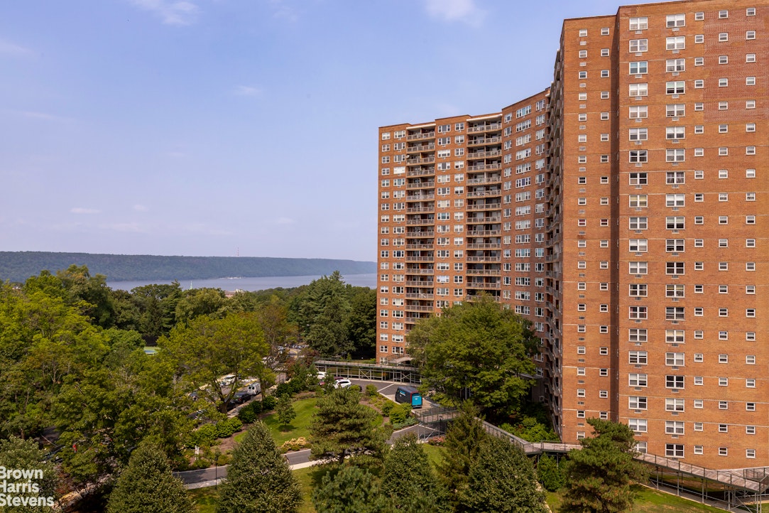 5700 Arlington Avenue, Unit 11X Bronx, NY 10471 - Photo 18 of 21 a view of a large building with a yard