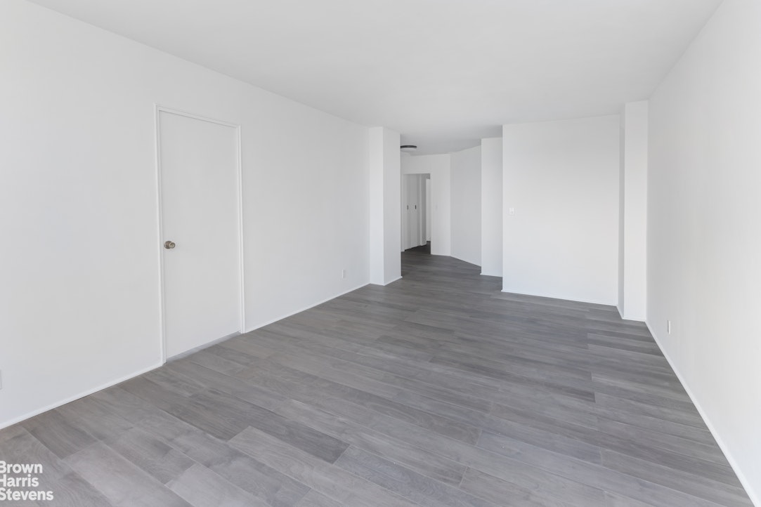5700 Arlington Avenue, Unit 11X Bronx, NY 10471 - Photo 3 of 21 a view of an empty room with wooden floor