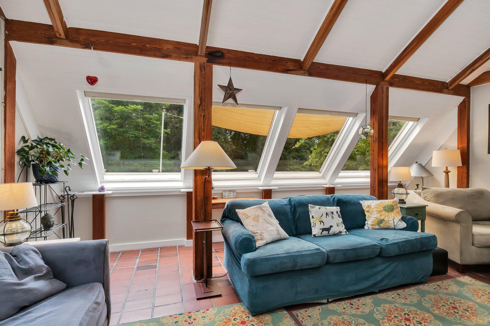 36 Bakers Pond Road Orleans, MA 02653 - Photo 17 of 50 a living room with furniture and a large window