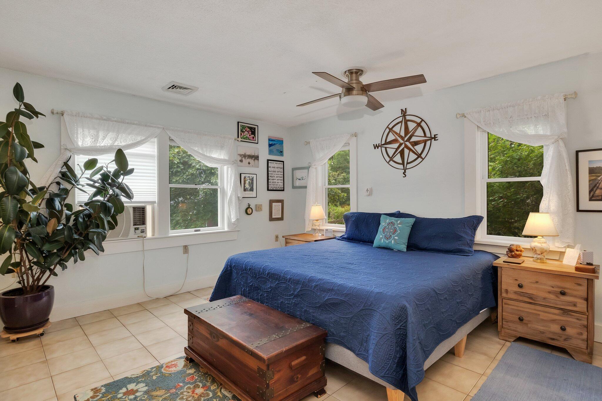 36 Bakers Pond Road Orleans, MA 02653 - Photo 19 of 50 a bedroom with a bed and a potted plant