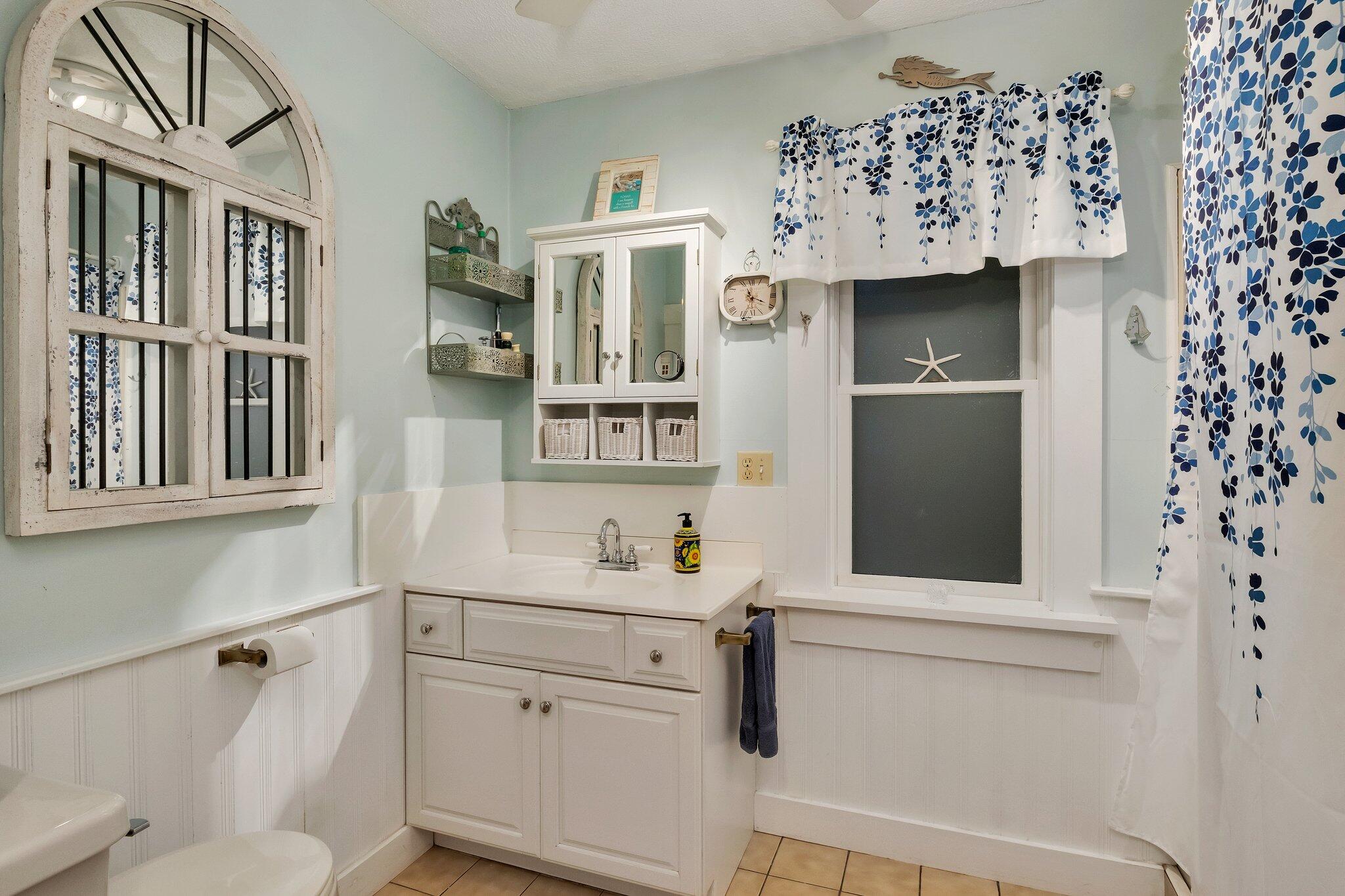 36 Bakers Pond Road Orleans, MA 02653 - Photo 22 of 50 a bathroom with a sink toilet and shower