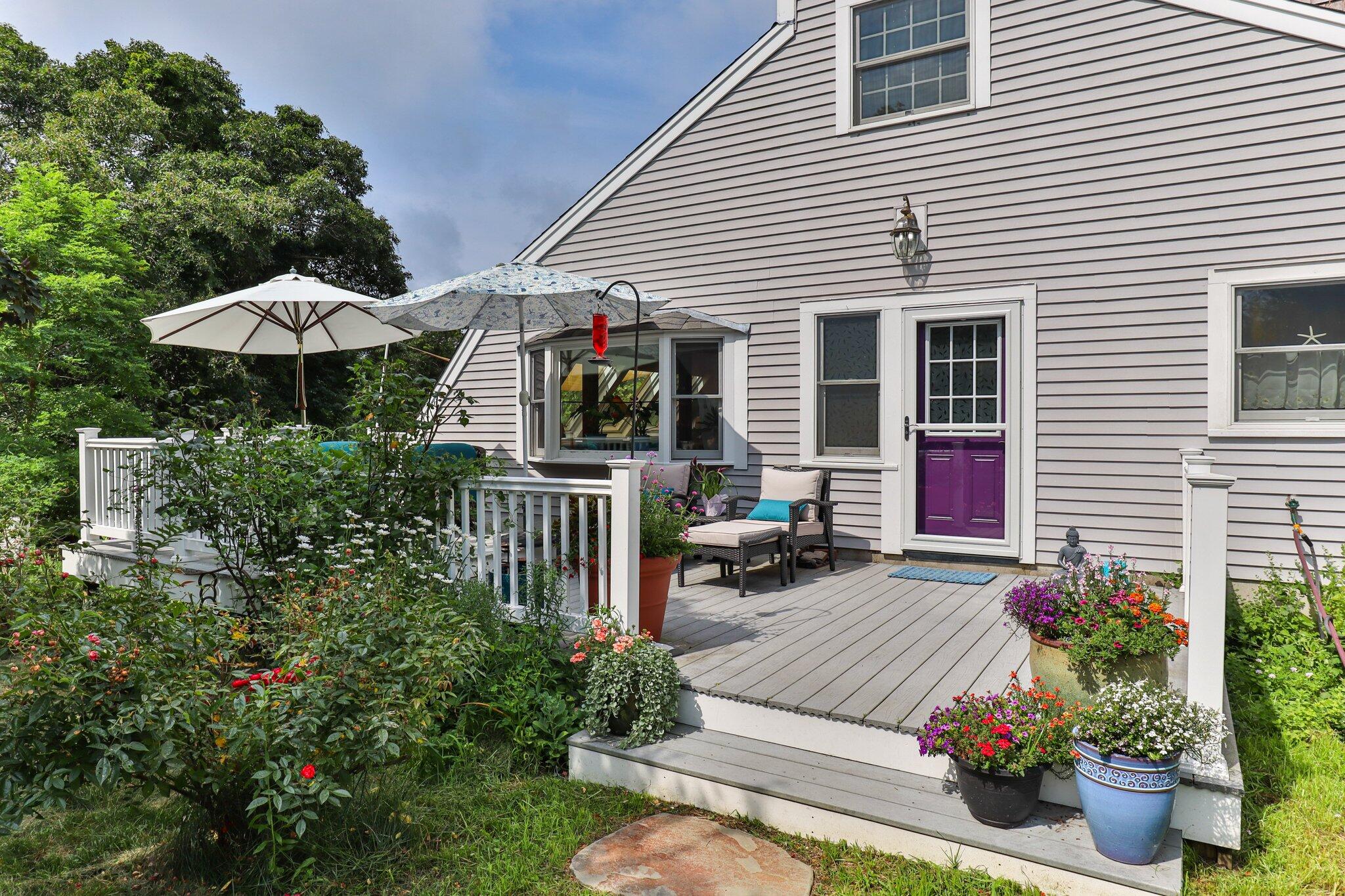 36 Bakers Pond Road Orleans, MA 02653 - Photo 3 of 50 a view of a patio with chairs and plants