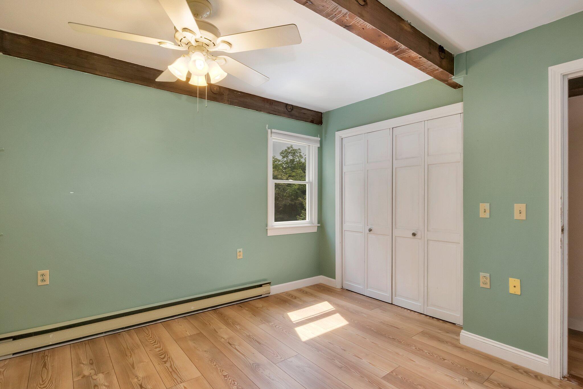 36 Bakers Pond Road Orleans, MA 02653 - Photo 33 of 50 a view of an empty room with window and wooden floor