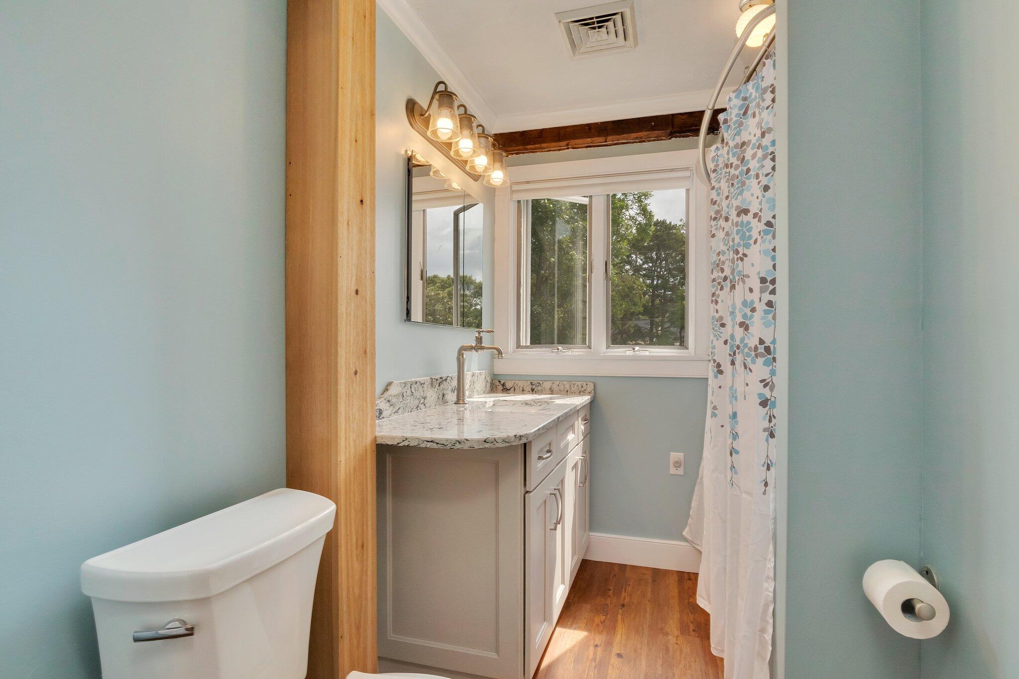 36 Bakers Pond Road Orleans, MA 02653 - Photo 35 of 50 a bathroom with a granite countertop sink toilet and shower