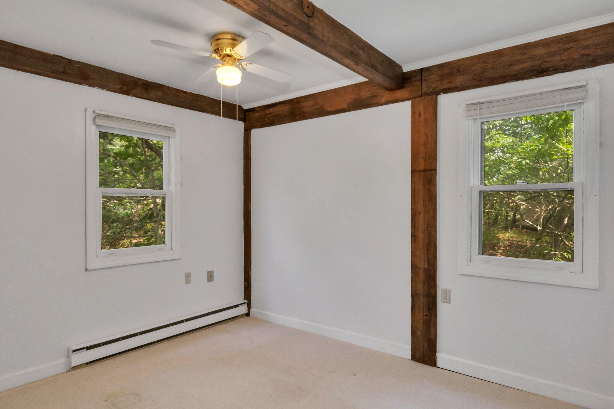 36 Bakers Pond Road Orleans, MA 02653 - Photo 36 of 50 an empty room with windows and ceiling fan
