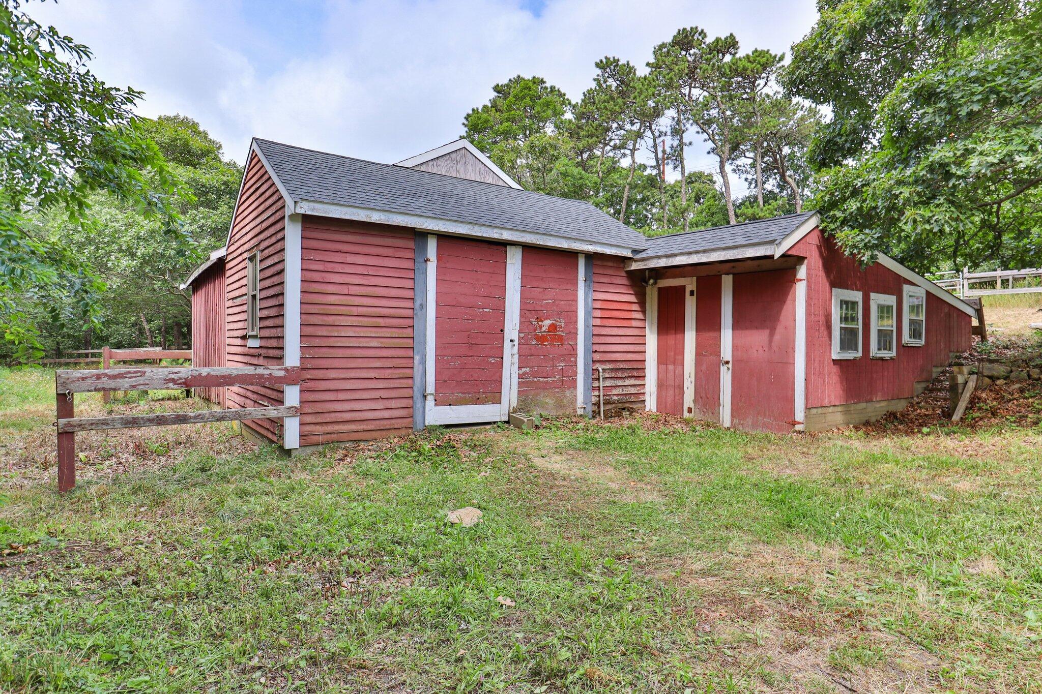 36 Bakers Pond Road Orleans, MA 02653 - Photo 39 of 50 a backyard of a house with seating space