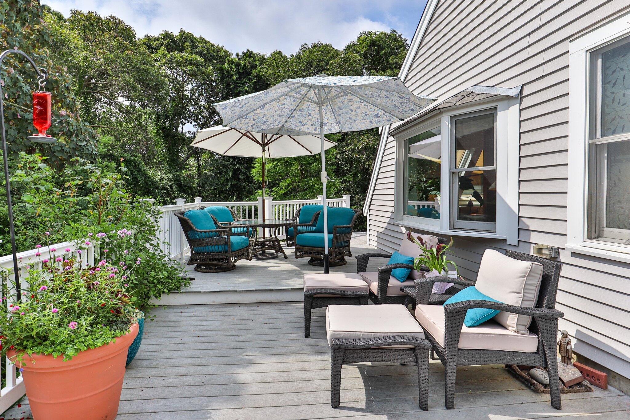 36 Bakers Pond Road Orleans, MA 02653 - Photo 4 of 50 a wooden bench sitting in front of a house