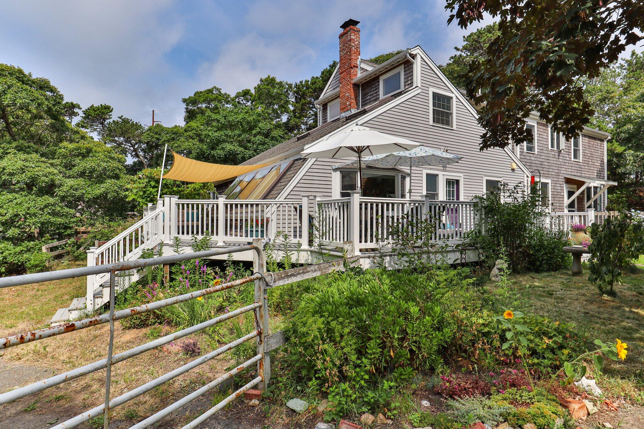 36 Bakers Pond Road Orleans, MA 02653 - Photo 5 of 50 a view of a house with backyard and sitting area