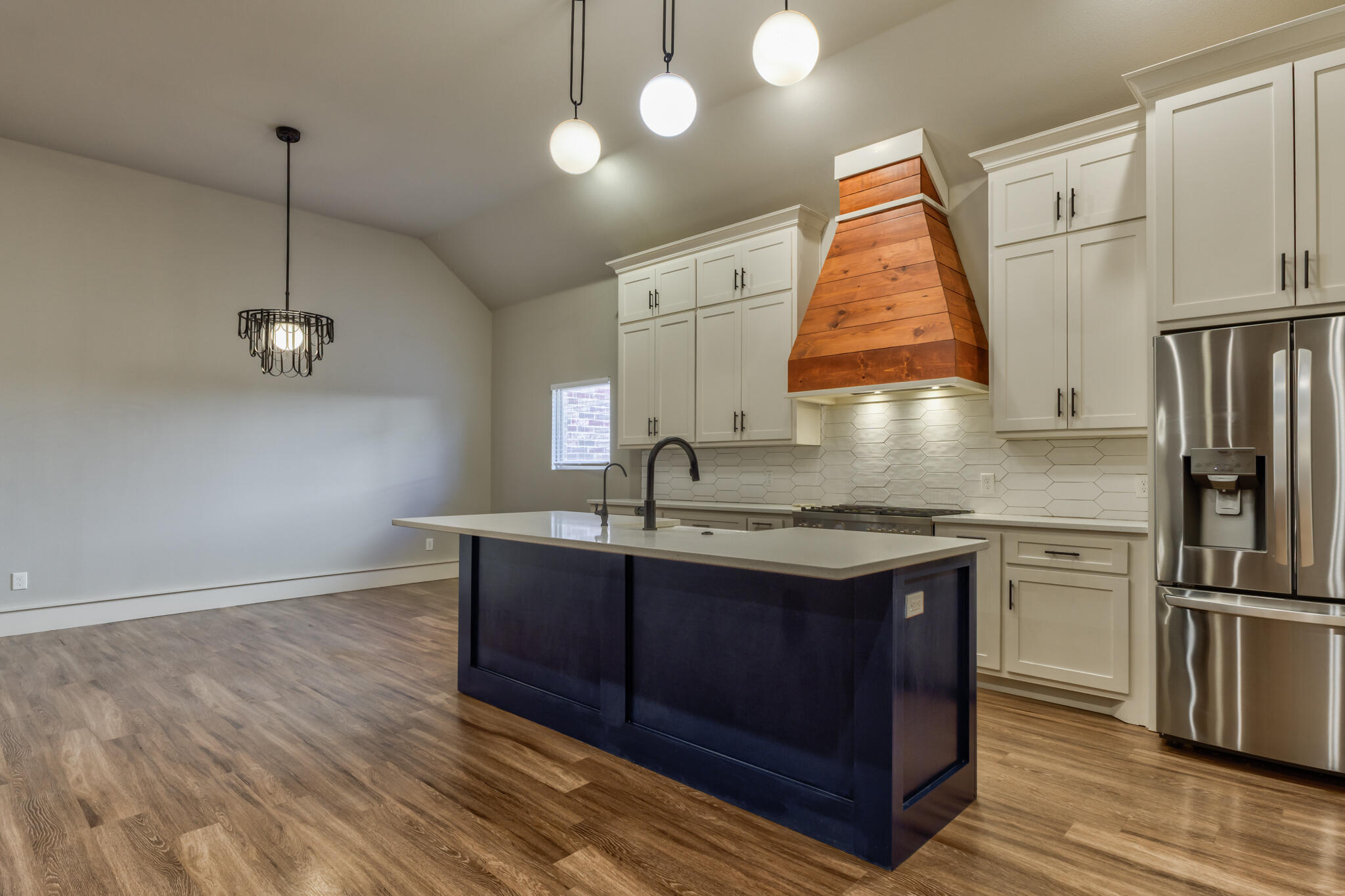 5303 110th Street Lubbock, TX 79424 - Photo 15 of 54 a kitchen with stainless steel appliances granite countertop a sink a stove and a refrigerator