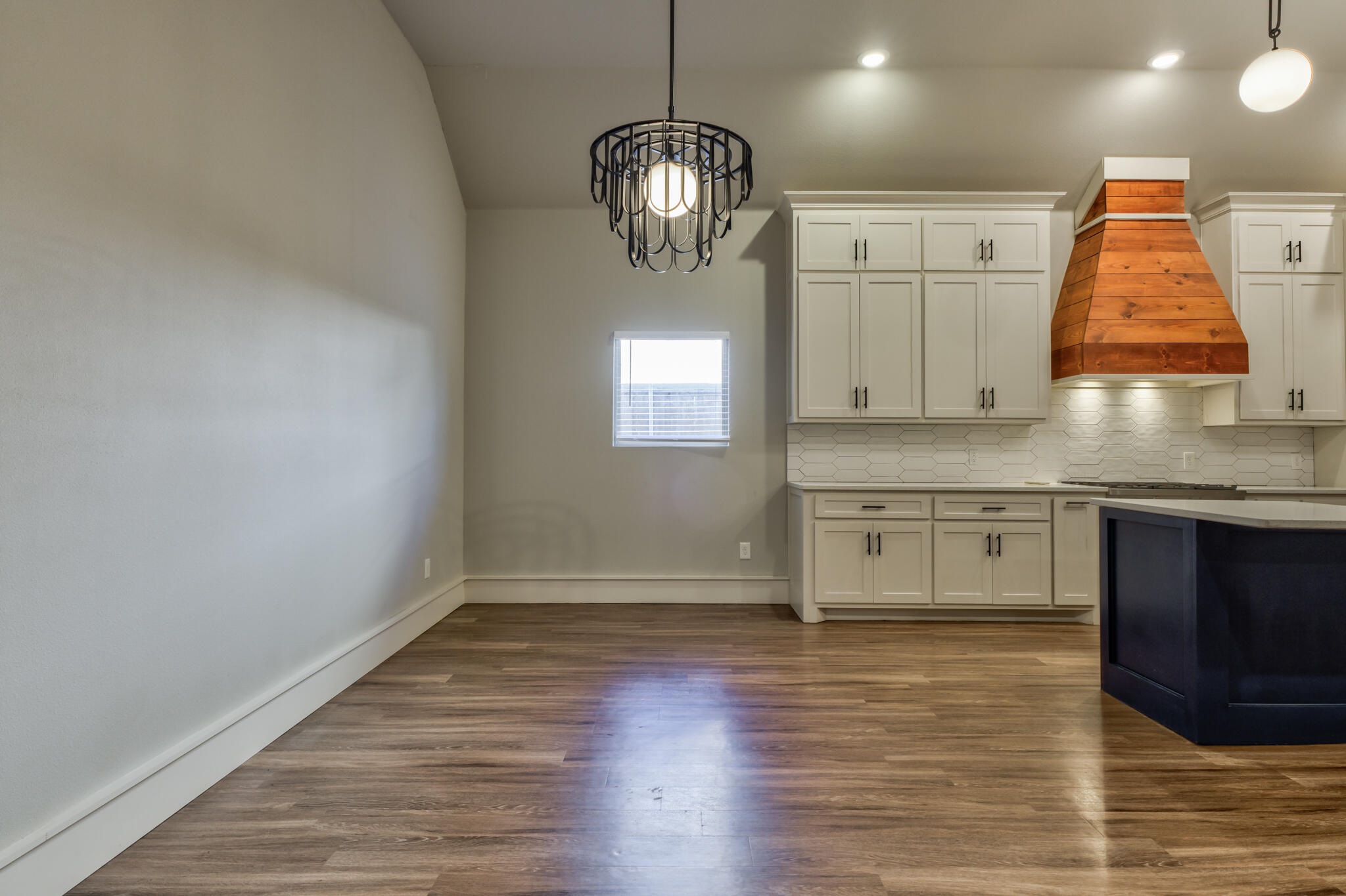 5303 110th Street Lubbock, TX 79424 - Photo 17 of 54 a view of a kitchen with wooden floor and staircase