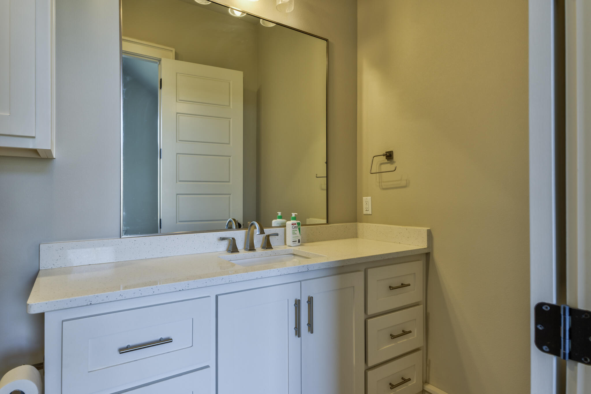 5303 110th Street Lubbock, TX 79424 - Photo 38 of 54 a bathroom with a sink and a mirror