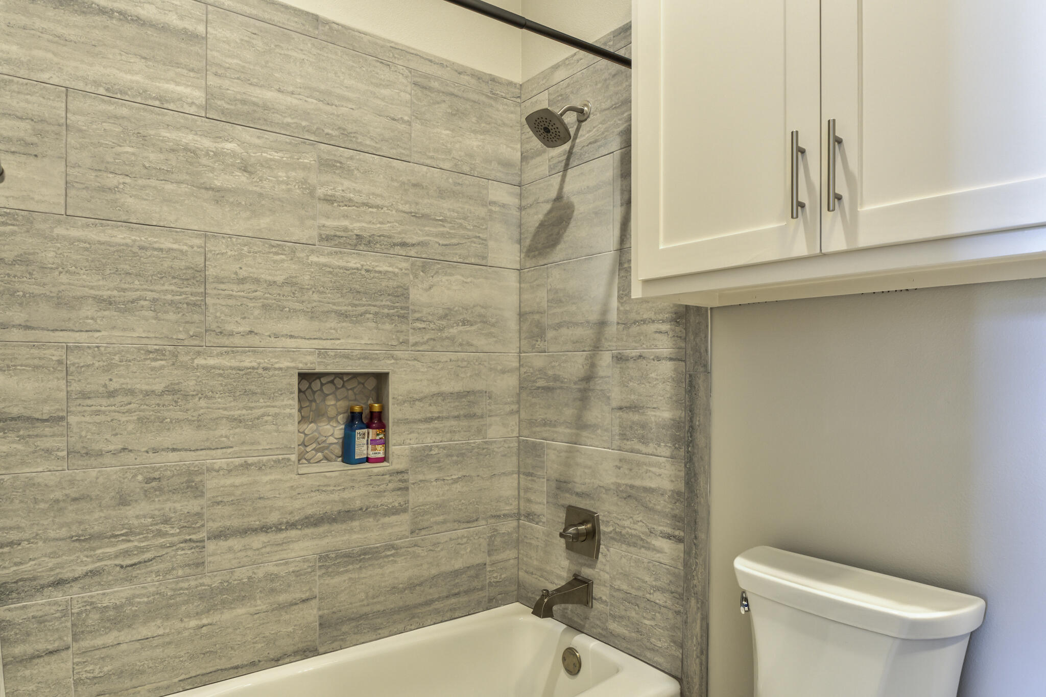 5303 110th Street Lubbock, TX 79424 - Photo 39 of 54 a bathroom with a toilet and a shower