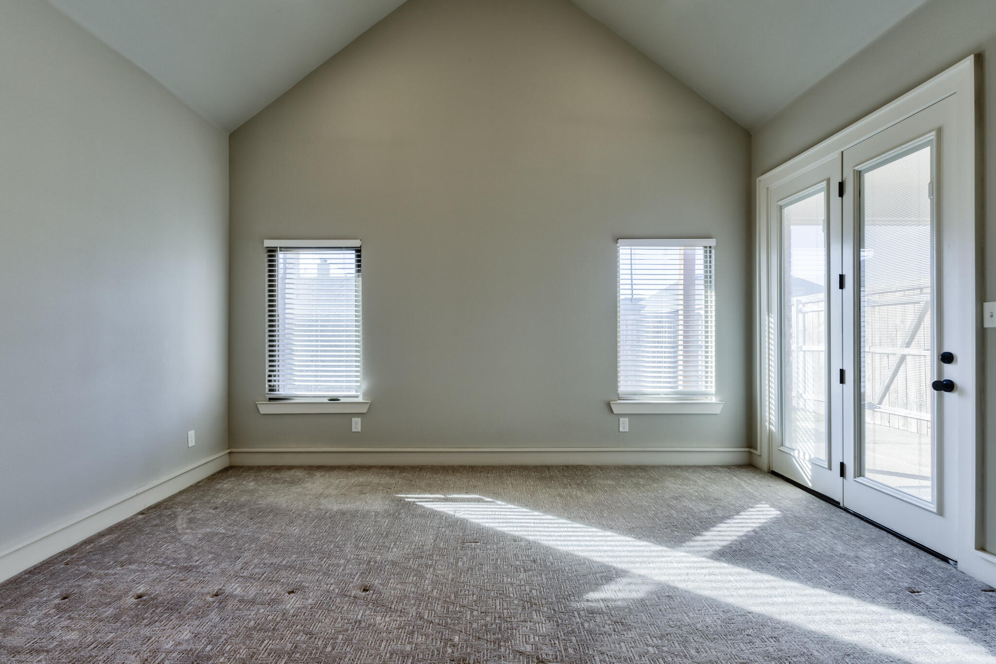 5303 110th Street Lubbock, TX 79424 - Photo 40 of 54 an empty room with a empty space and windows