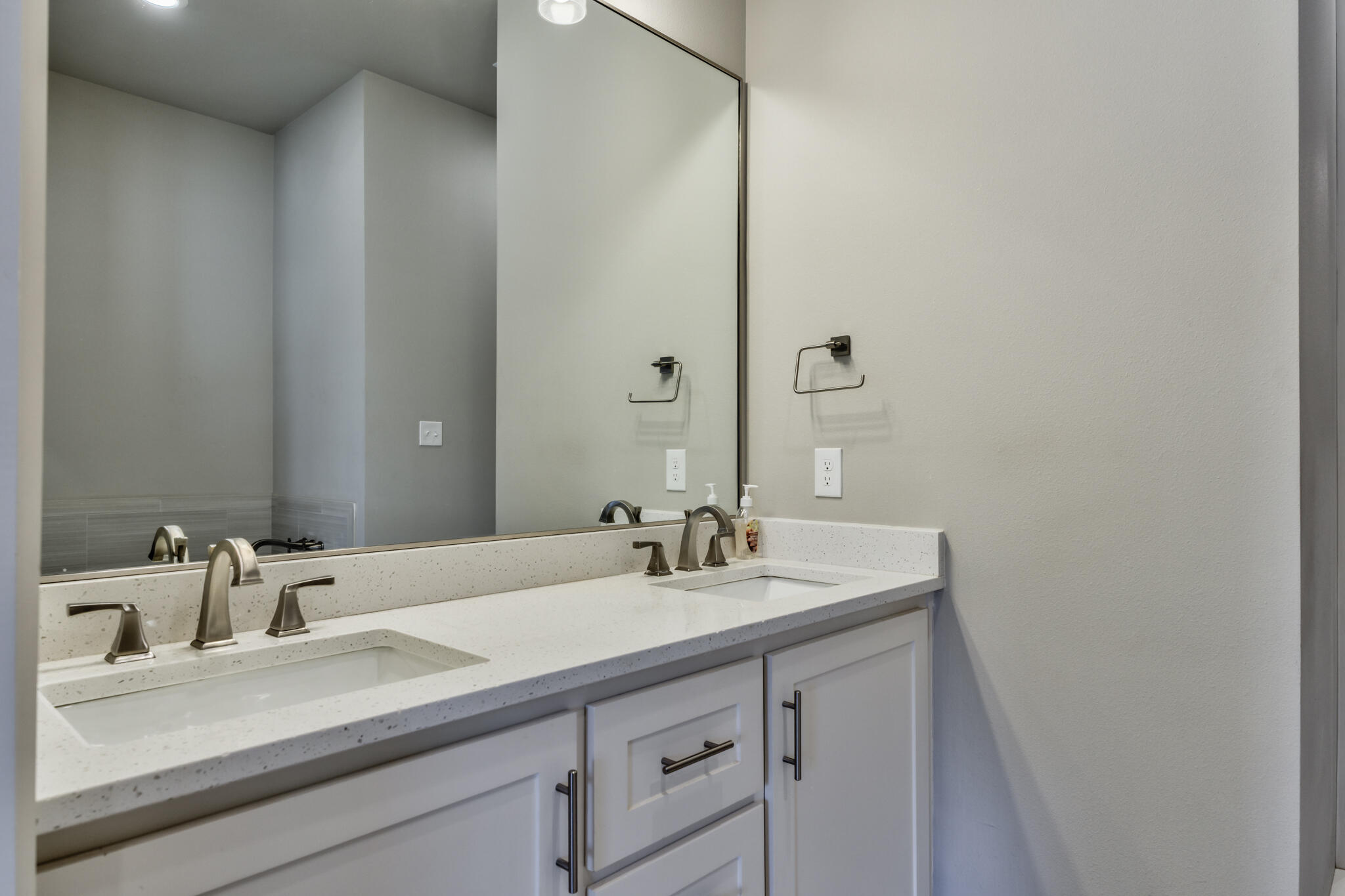 5303 110th Street Lubbock, TX 79424 - Photo 43 of 54 a bathroom with a sink and a mirror