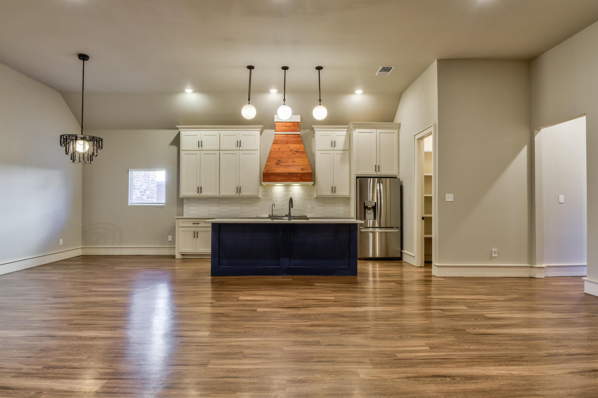 5303 110th Street Lubbock, TX 79424 - Photo 7 of 54 a view of kitchen with granite countertop cabinets and refrigerator