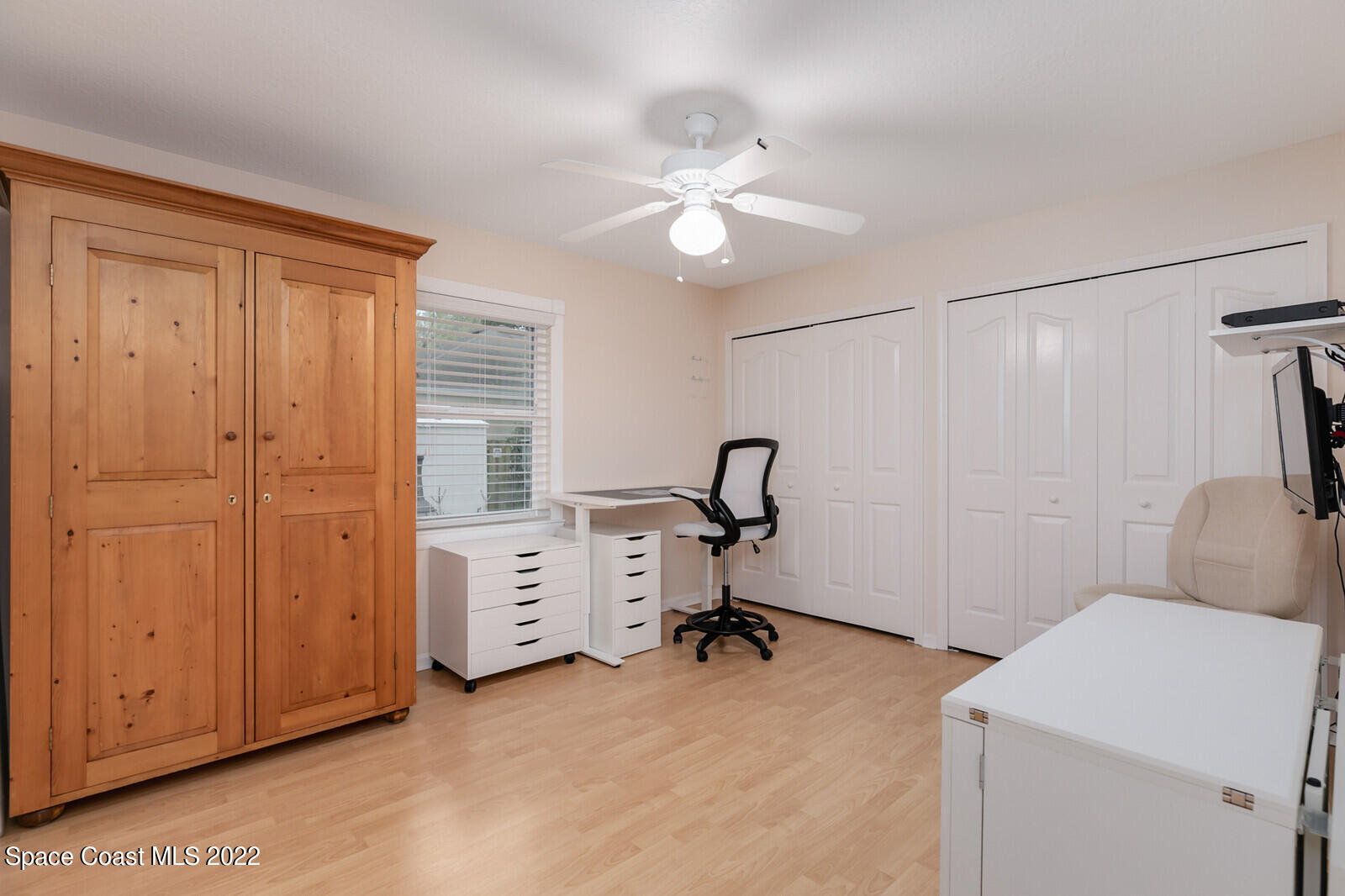 4885 Doreen Road Cocoa, FL 32927 - Photo 12 of 21 a view of a bedroom with a workspace