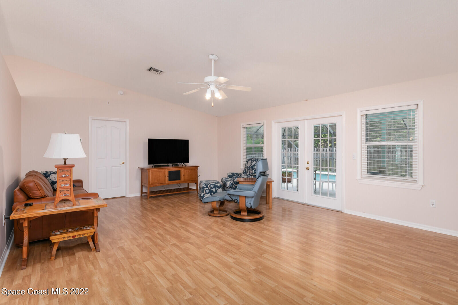 4885 Doreen Road Cocoa, FL 32927 - Photo 16 of 21 a living room with furniture and a flat screen tv