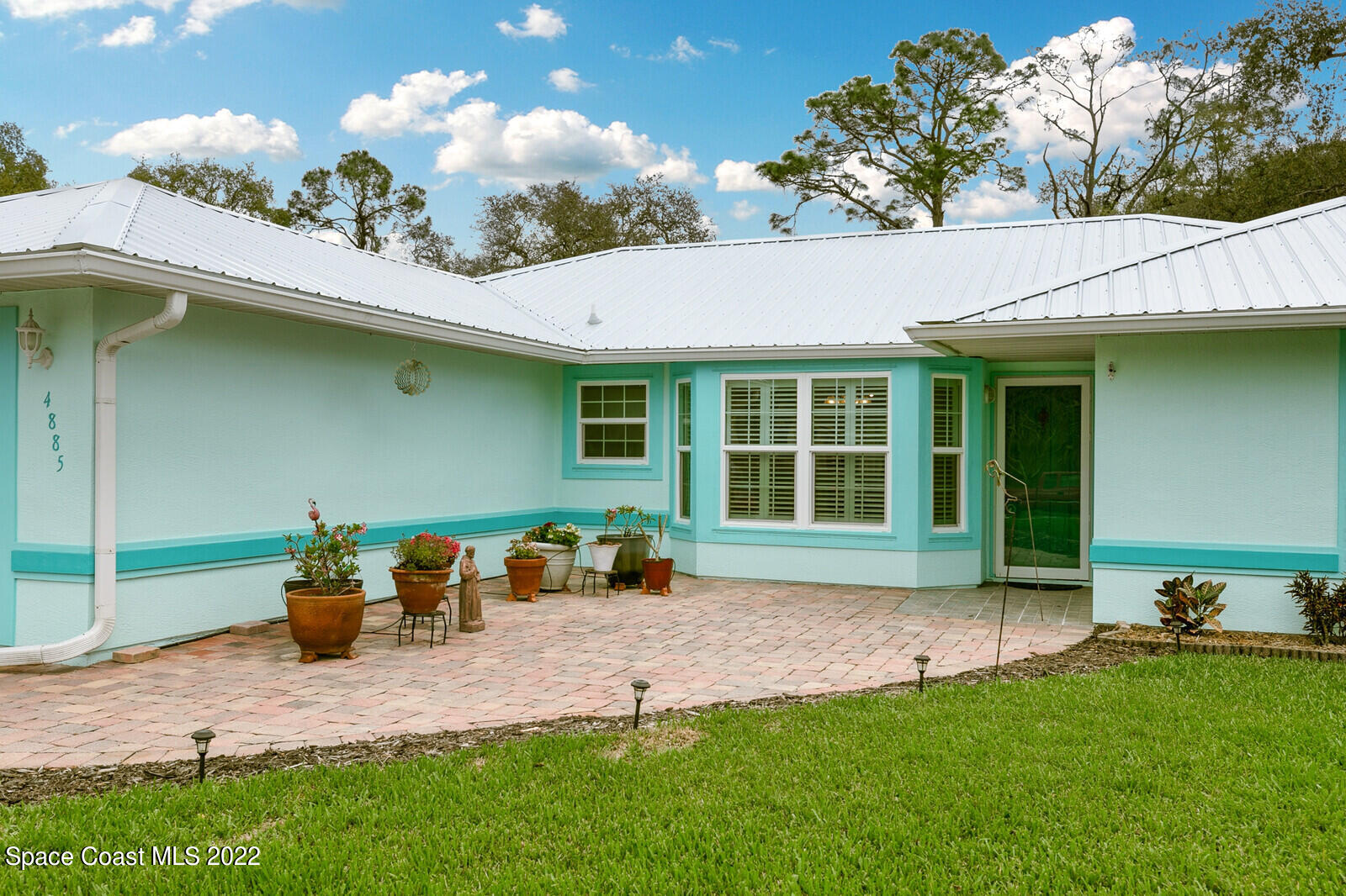 4885 Doreen Road Cocoa, FL 32927 - Photo 19 of 21 a front view of a house with patio