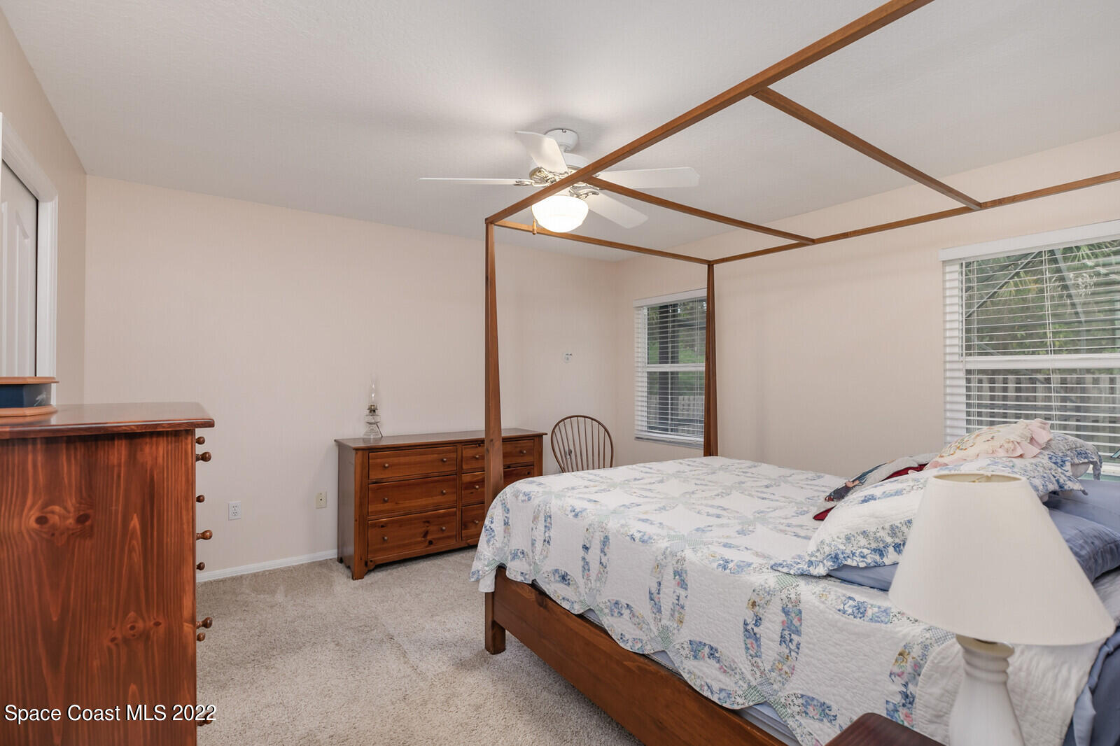 4885 Doreen Road Cocoa, FL 32927 - Photo 20 of 21 a bedroom with a bed and cabinets