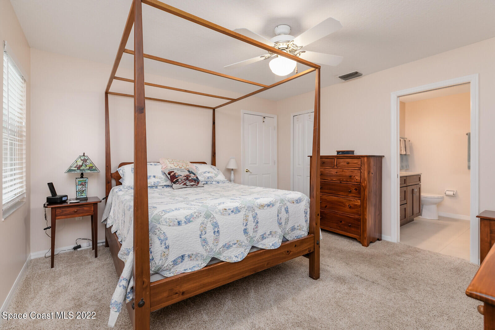 4885 Doreen Road Cocoa, FL 32927 - Photo 7 of 21 a bedroom with a bed and a table