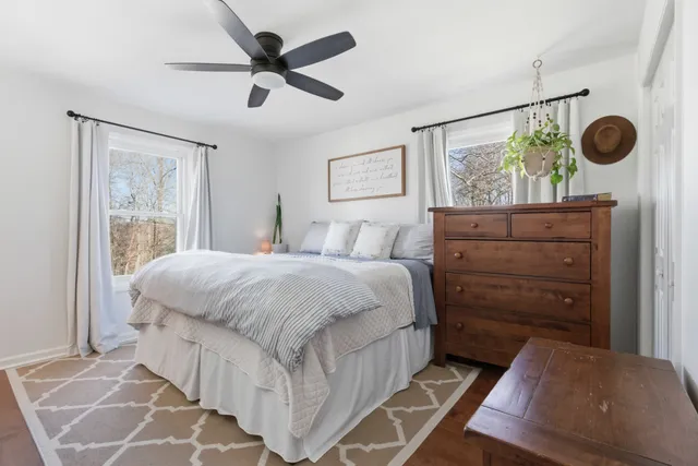 a bedroom with a bed and a dresser